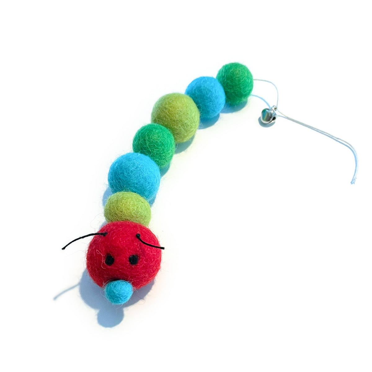Red, blue, and green shaped wool balls formed into a caterpillar with a bell.